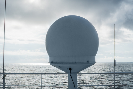 Sattelite communication VSAT antenna on the top monkey deckの写真素材