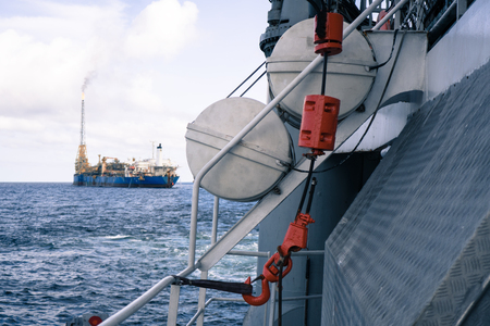 View from offshore vessel deck to open sea. FPSO tanker vessel is on backgroundの写真素材