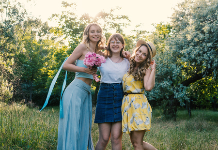 Three of girls friends outdoor in the park or forestの写真素材