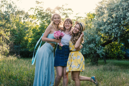 Three of girls friends outdoor in the park or forestの写真素材