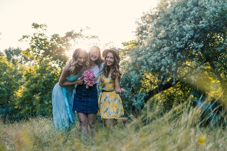 Three of girls friends outdoor in the park or forestの写真素材