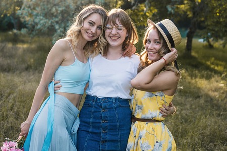 Three of girls friends outdoor in the park or forestの写真素材