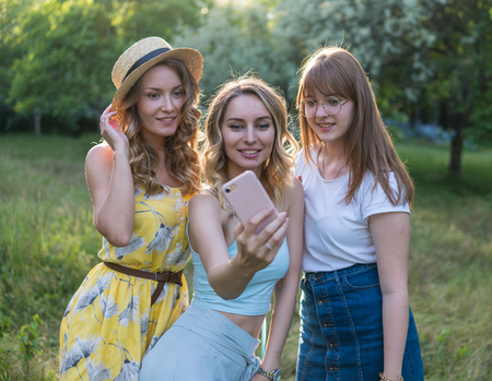 Group of girls friends take selfie photoの写真素材