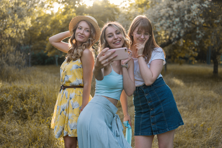 Group of girls friends take selfie photoの写真素材