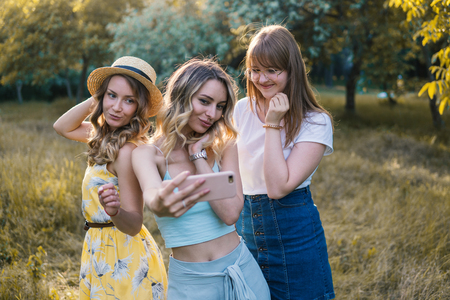 Group of girls friends take selfie photoの写真素材