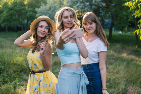 Group of girls friends take selfie photoの写真素材