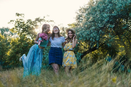Three of girls friends outdoor in the park or forestの写真素材