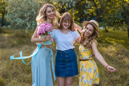Three of girls friends outdoor in the park or forestの写真素材