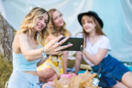 Group of girls friends take selfie photoの写真素材