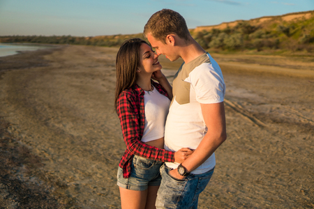 lovestory of couple on the beach On the Sunsetの写真素材