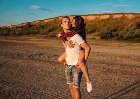 lovestory of couple on the beach On the Sunsetの写真素材