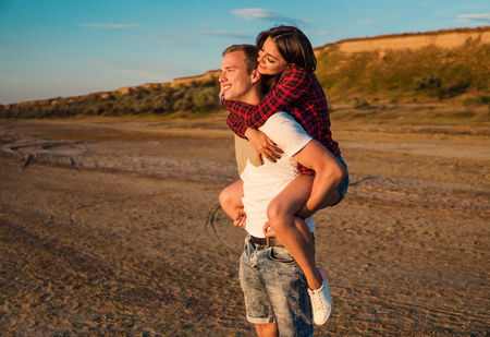 lovestory of couple on the beach On the Sunsetの写真素材