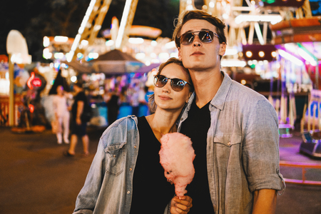 Lovely young hipster couple dating during summer sunset.の写真素材