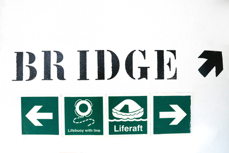 Ship or vessel emergency international signs on the wallの写真素材