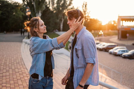 Lovely young hipster couple dating during summer sunset.の写真素材