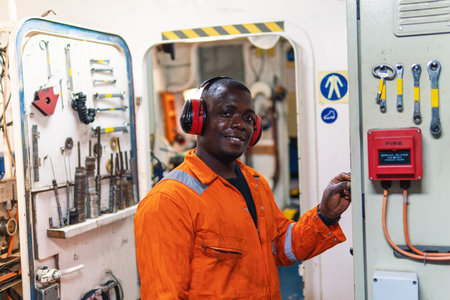 Marine engineer officer working in engine roomの写真素材