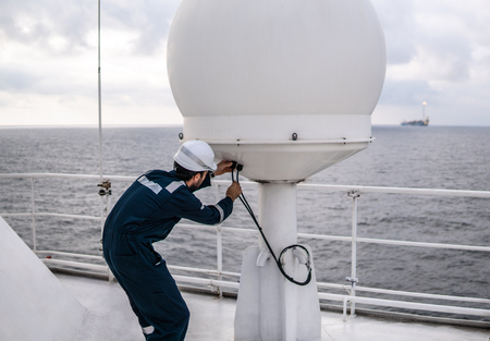 Service technician or serviceman near VSAT terminalの写真素材