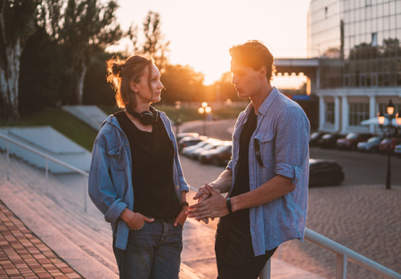 Lovely young hipster couple dating during summer sunset.の写真素材