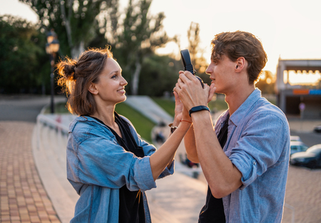 Lovely young hipster couple dating during summer sunset.の写真素材