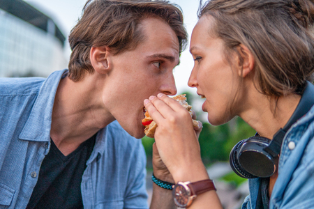 Lovely young hipster couple dating during summer sunset.の写真素材