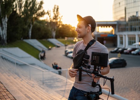 Videographer with video equipment, steadicam 3 axis gimbalの写真素材