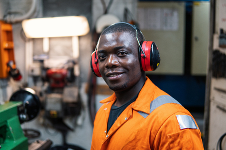Marine engineer officer working in engine roomの写真素材