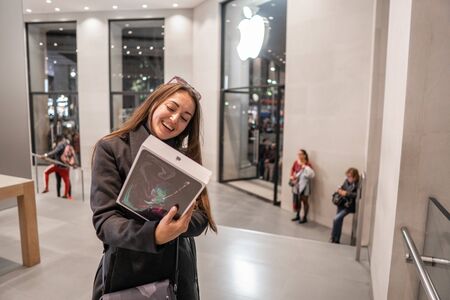 Barcelona, Spain - November 07, 2018: Woman holding a new iPad Pro