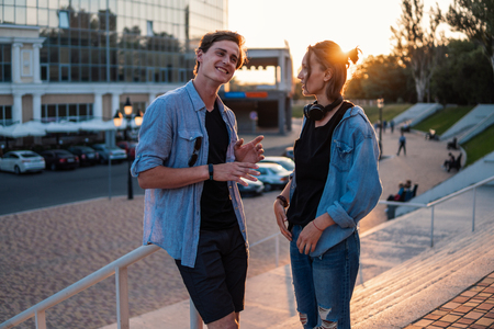 Lovely young hipster couple dating during summer sunset.の写真素材