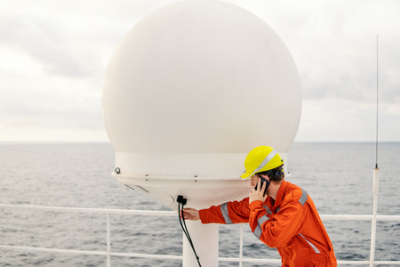 Service technician or serviceman near VSAT terminalの写真素材