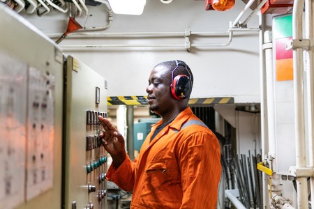 Marine engineer officer working in engine room