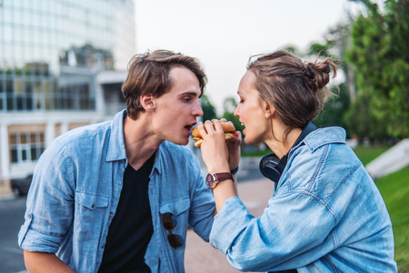 Lovely young hipster couple dating during summer sunset.の写真素材