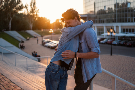 Lovely young hipster couple dating during summer sunset.の写真素材