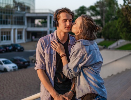 Lovely young hipster couple dating during summer sunset.の写真素材