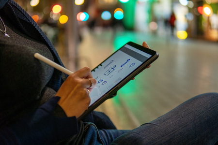 woman drawing on digital tablet with stylus pencil.の写真素材