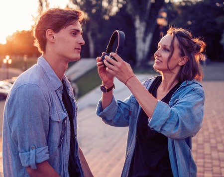 Lovely young hipster couple dating during summer sunset.の写真素材