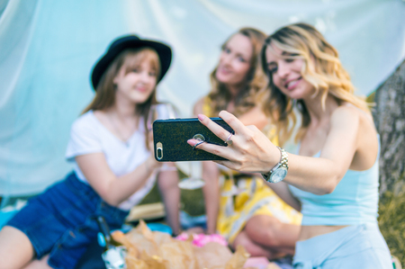 Group of girls friends take selfie photoの写真素材