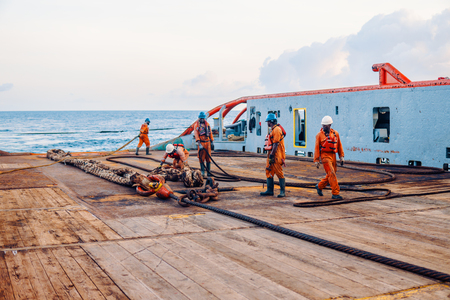 Vessel crew preparing vessel for static tow tanker liftingの写真素材