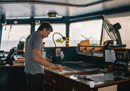 Marine navigational officer or chief mate on navigation watchの写真素材