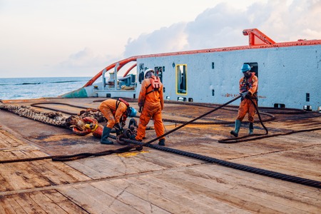 Vessel crew preparing vessel for static tow tanker liftingの写真素材