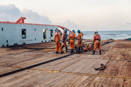Vessel crew preparing vessel for static tow tanker liftingの写真素材