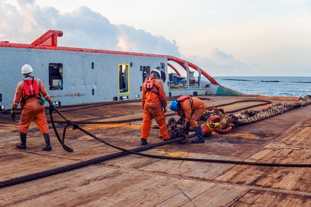 Vessel crew preparing vessel for static tow tanker liftingの写真素材
