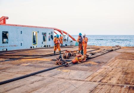 Vessel crew preparing vessel for static tow tanker liftingの写真素材