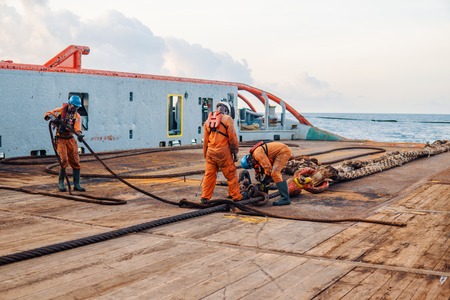 Vessel crew preparing vessel for static tow tanker liftingの写真素材