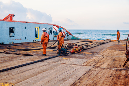 Vessel crew preparing vessel for static tow tanker liftingの写真素材