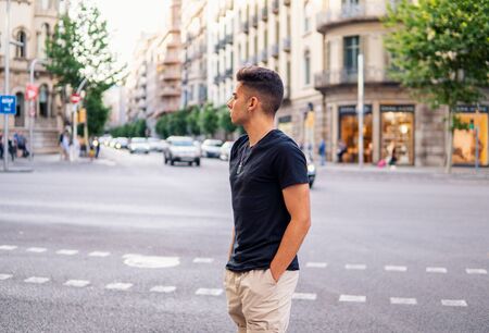 fashionable handsome man on the street of modern cityの写真素材
