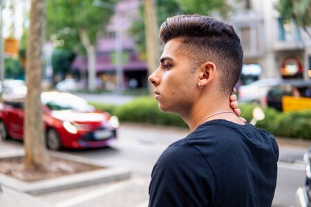 fashionable handsome man on the street of modern cityの写真素材