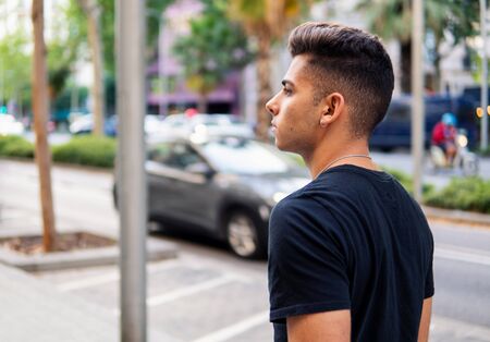 fashionable handsome man on the street of modern cityの写真素材