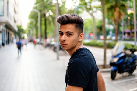 fashionable handsome man on the street of modern cityの写真素材