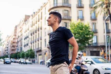 fashionable handsome man on the street of modern cityの写真素材