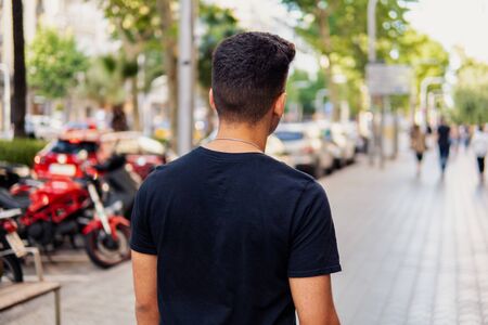 fashionable handsome man on the street of modern cityの写真素材